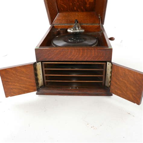 Victrola Wood 8-in-1 Nostalgic Bluetooth Record Player with USB Encoding and 3-speed Turntable. . Victrola antique crank record player